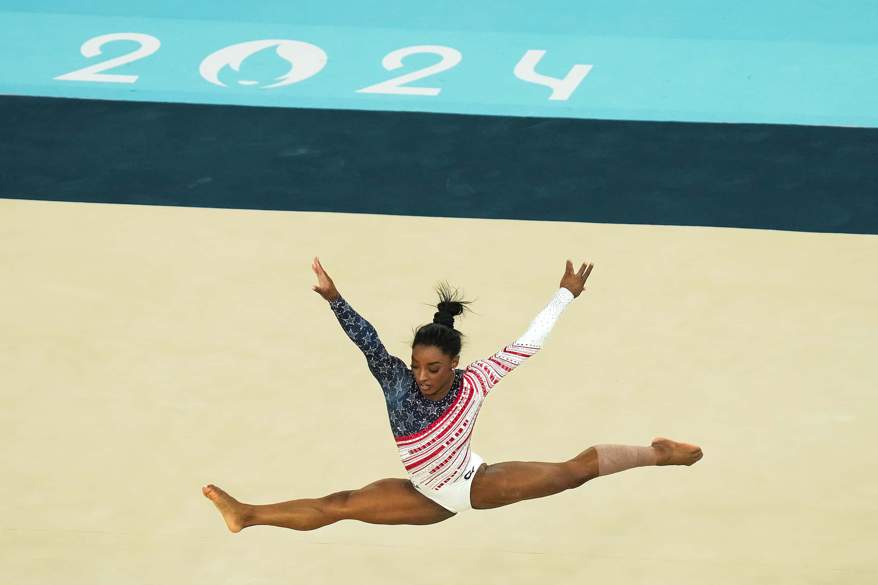 Simone Biles of the United States competes on the floor during the women’s gymnastics team...