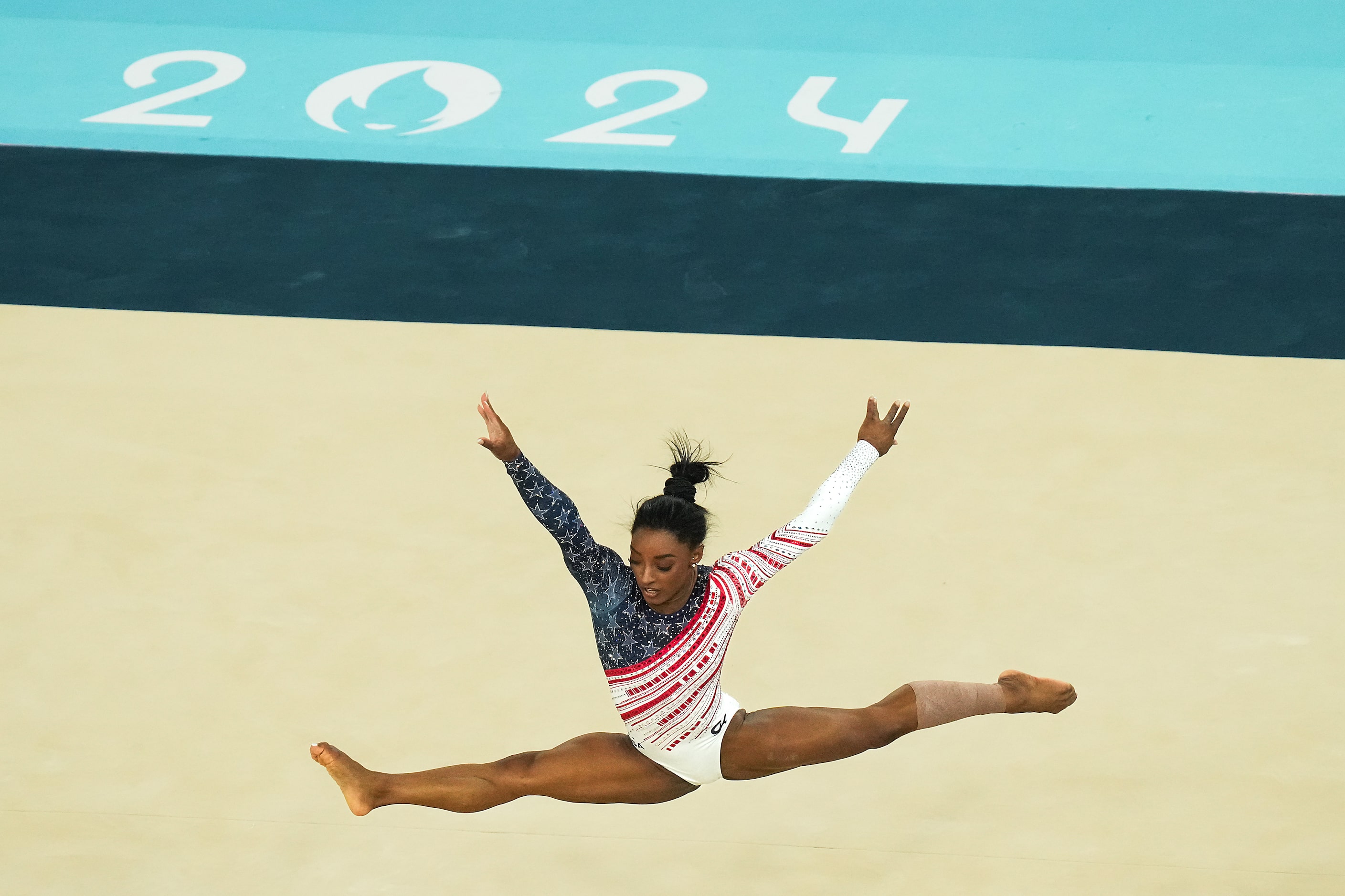 Simone Biles of the United States competes on the floor during the women’s gymnastics team...