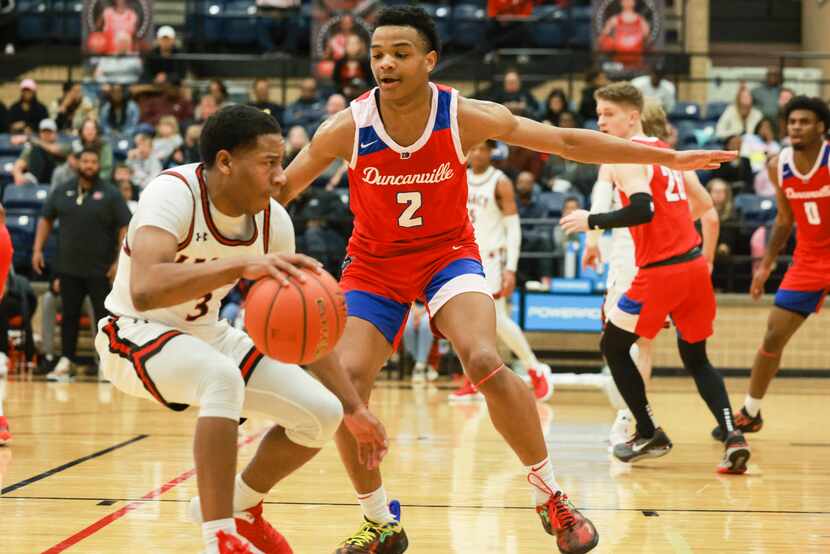 Duncanville High School’s Evan Phelps (2) defends Mansfield Legacy High School’s Jhaden...