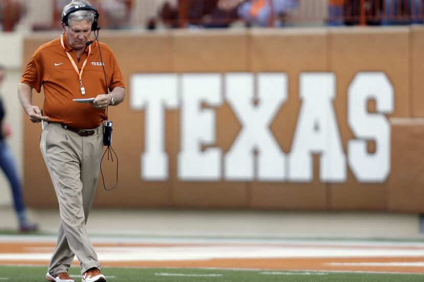 Texas coach Mack Brown walks on the field during the team's spring game in Austin. Brown has...