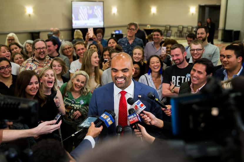 Colin Allred, congressional candidate for Texas District 32, speaks to reporters after...