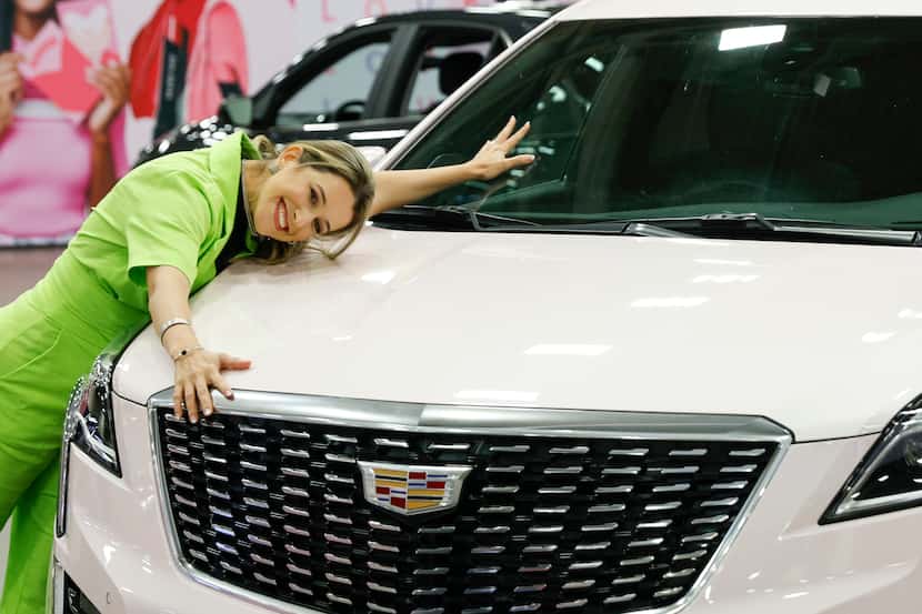 Carla Fenali of Brazil posed Monday with a pink Cadillac at the annual Mary Kay Seminar at...