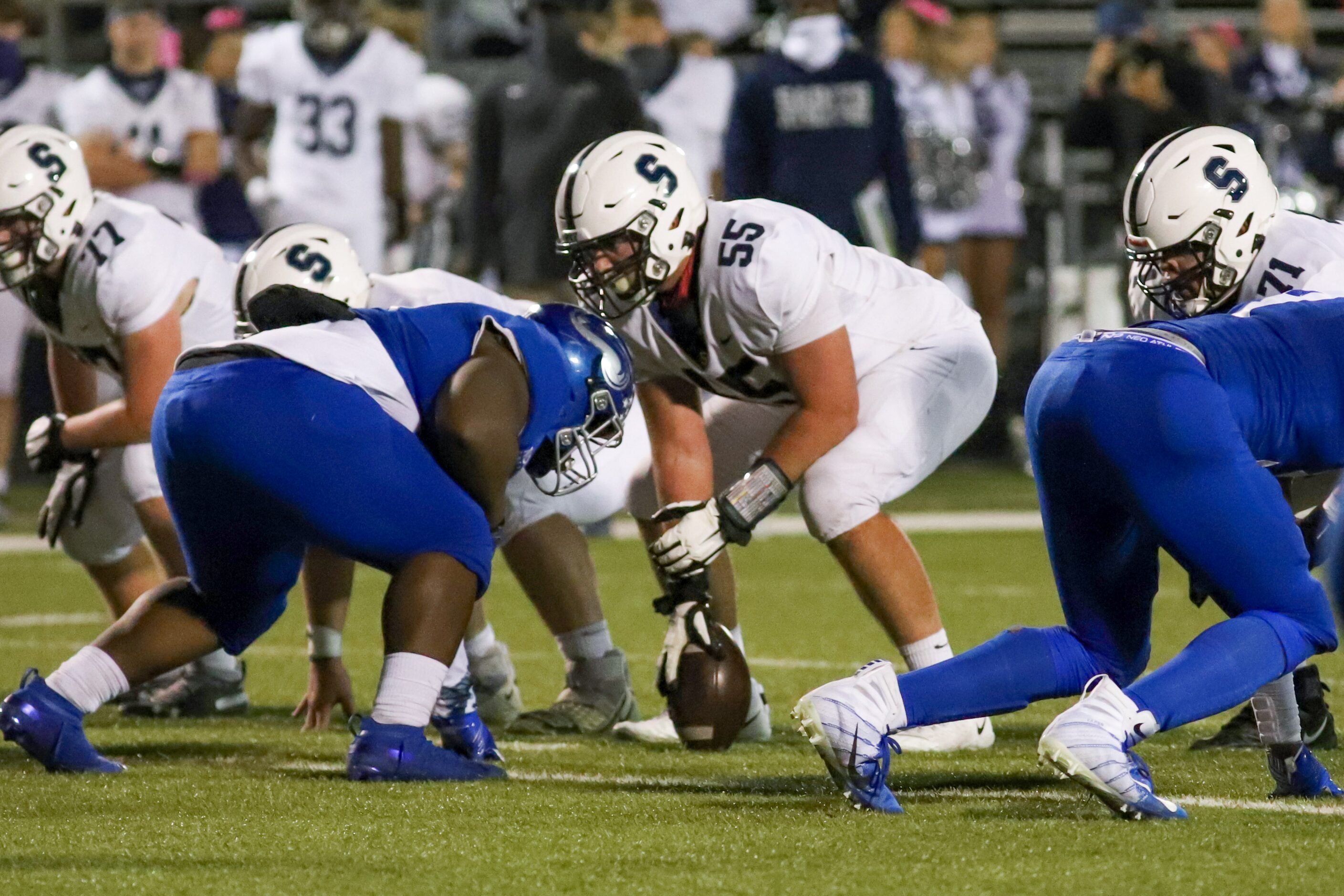 Fort Worth All Saints center James Brockermeyer (55) holds for the snap against Fort Worth...