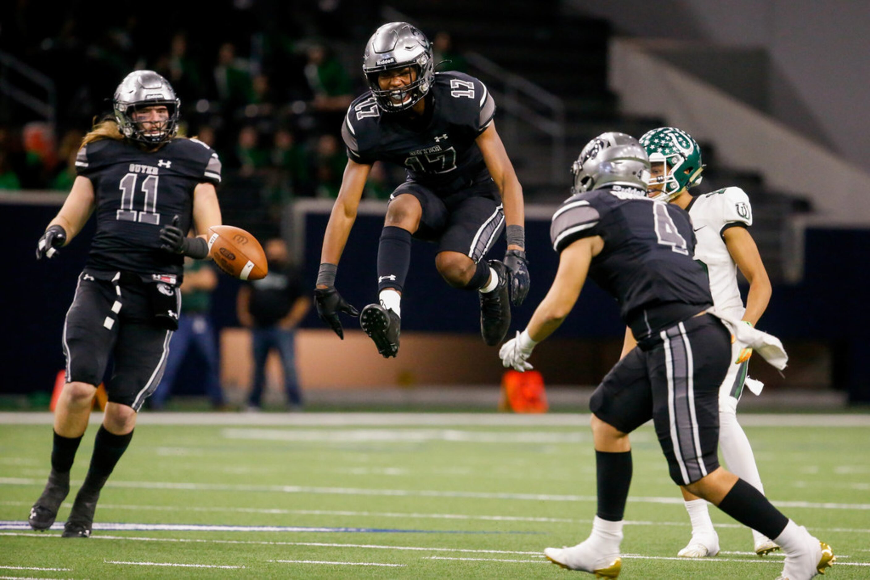 Denton Guyer's defensive back Jaden Fugett (17) (center) celebrates blocking a Guyer pass in...