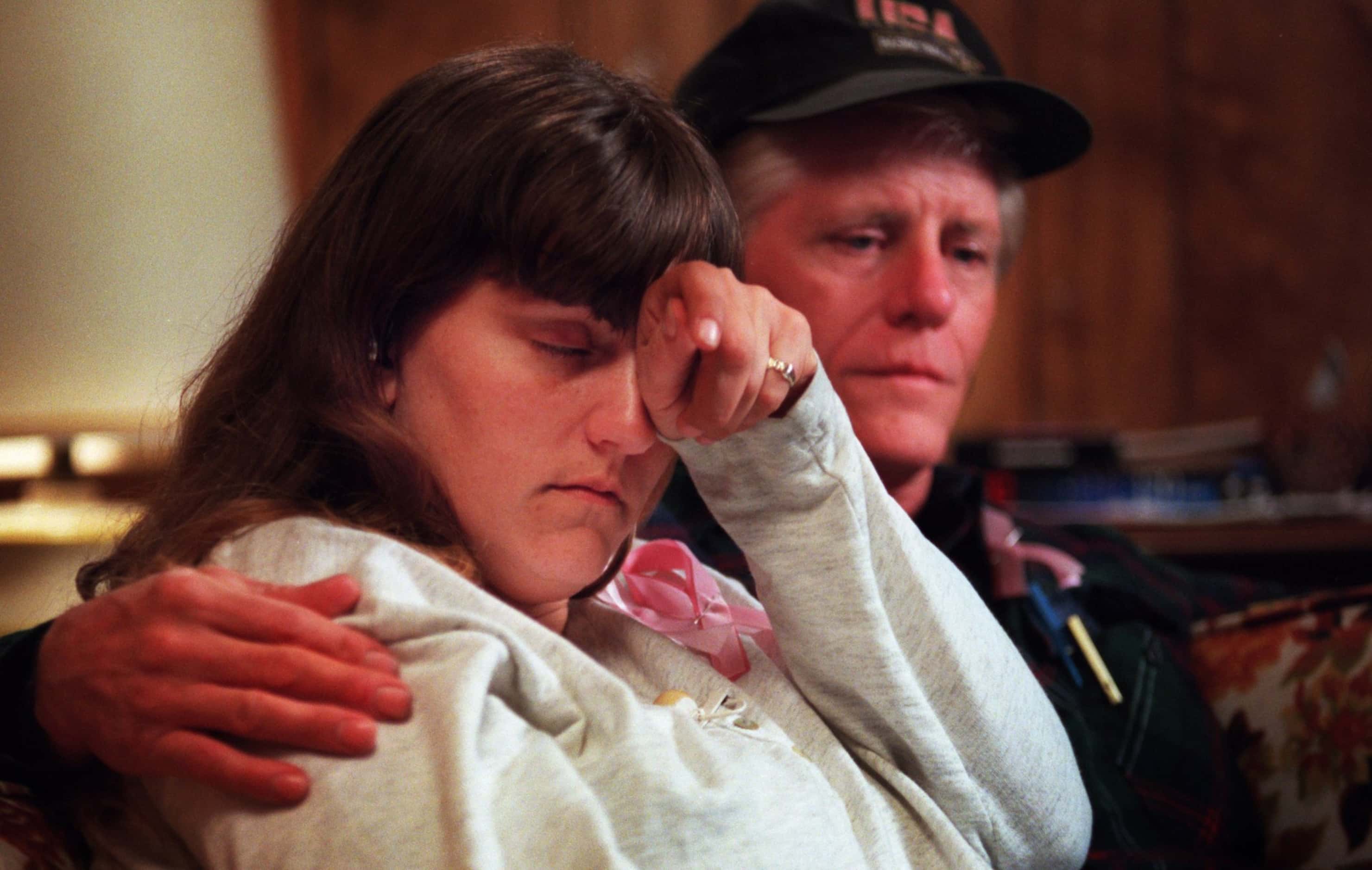 Amber Hagerman's parents, Donna  Whitson and Richard E. Hagerman, listen to a summary of...