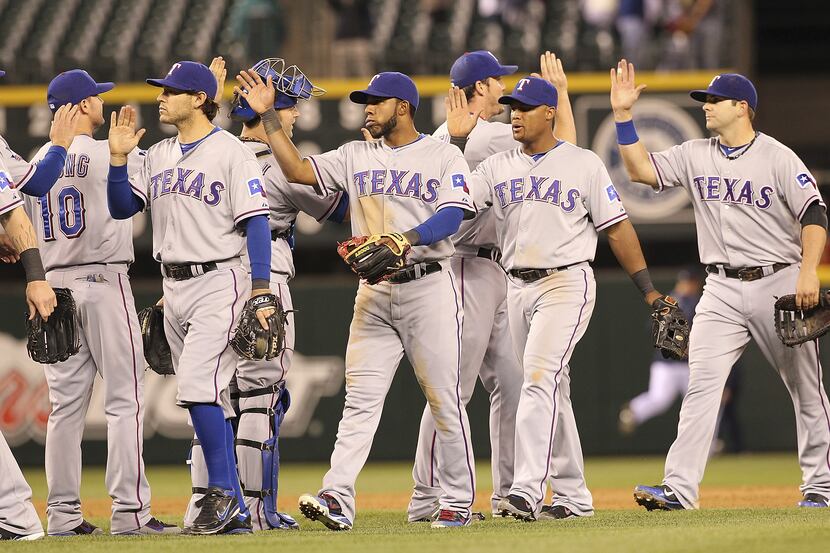 Rangers players congratulate each other after their 3-1 victory, which evened the three-game...