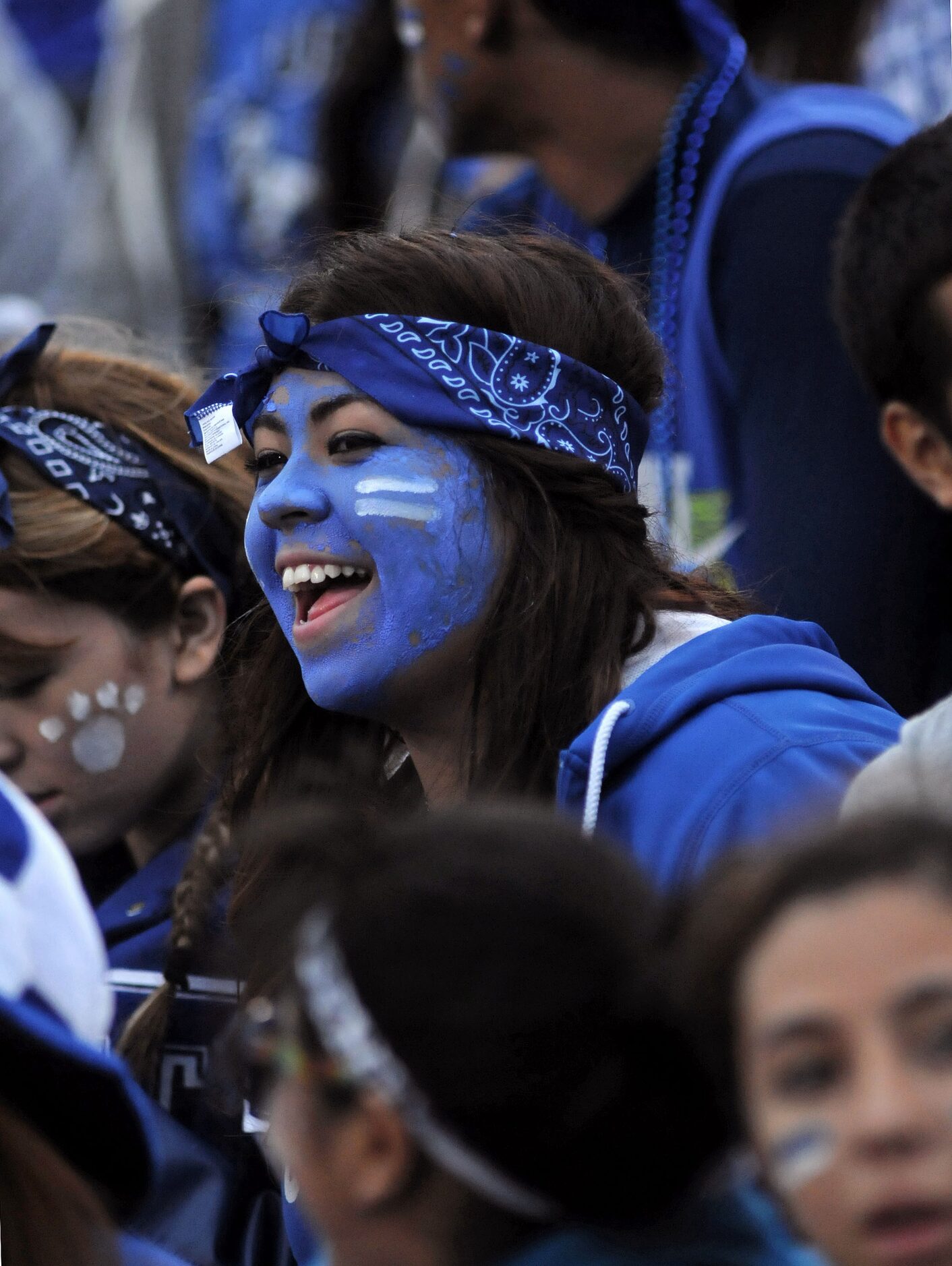 R.L. Turner junior Maria Maldonado cheers in the student section before a high school...