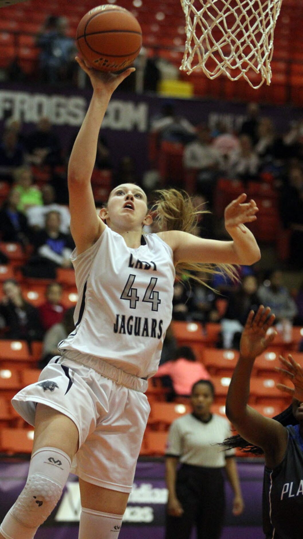 Flower Mound High School junior Lauren Cox (44) puts up a shot against Plano West in the...