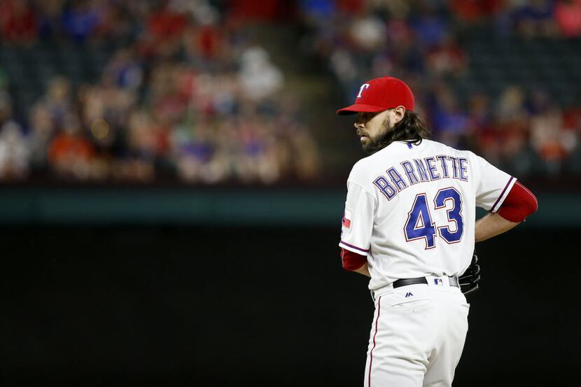 Rangers relief pitcher Tony Barnette (43) gets ready to throw a pitch against Orioles during...