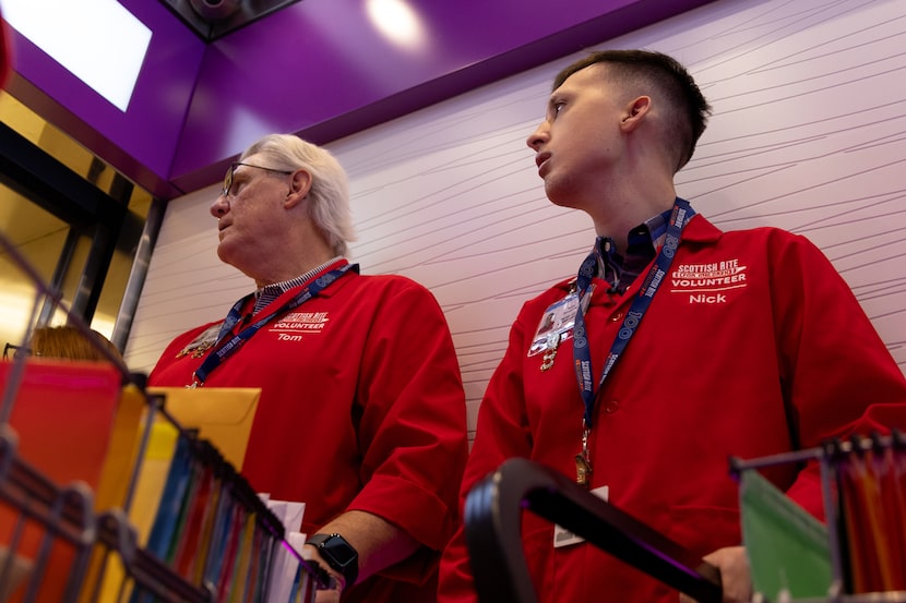 Tom Shehan (left) and Nick Bloczynski make their mail rounds at the Scottish Rite Hospital...