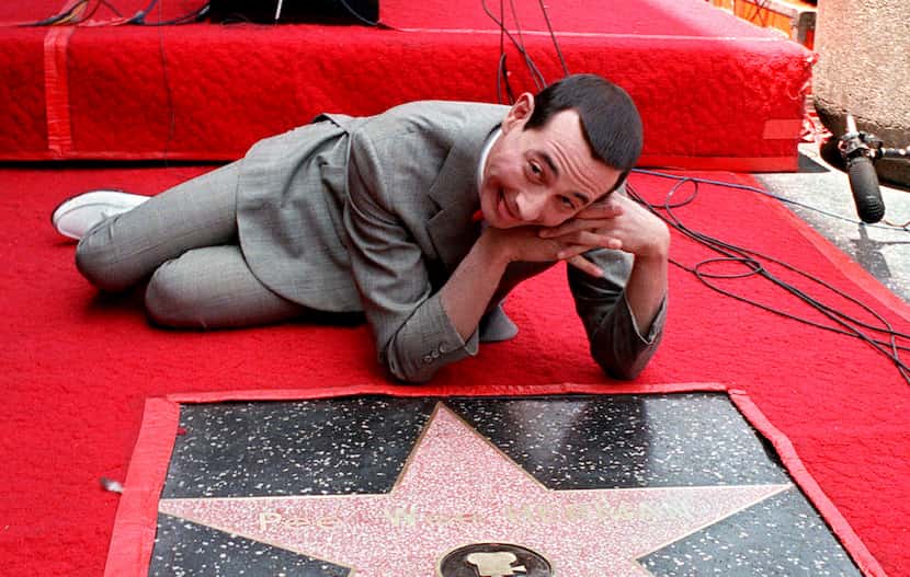 Comedian Pee Wee Herman, whose real name is Paul Reubens, admires his star on the Walk of...
