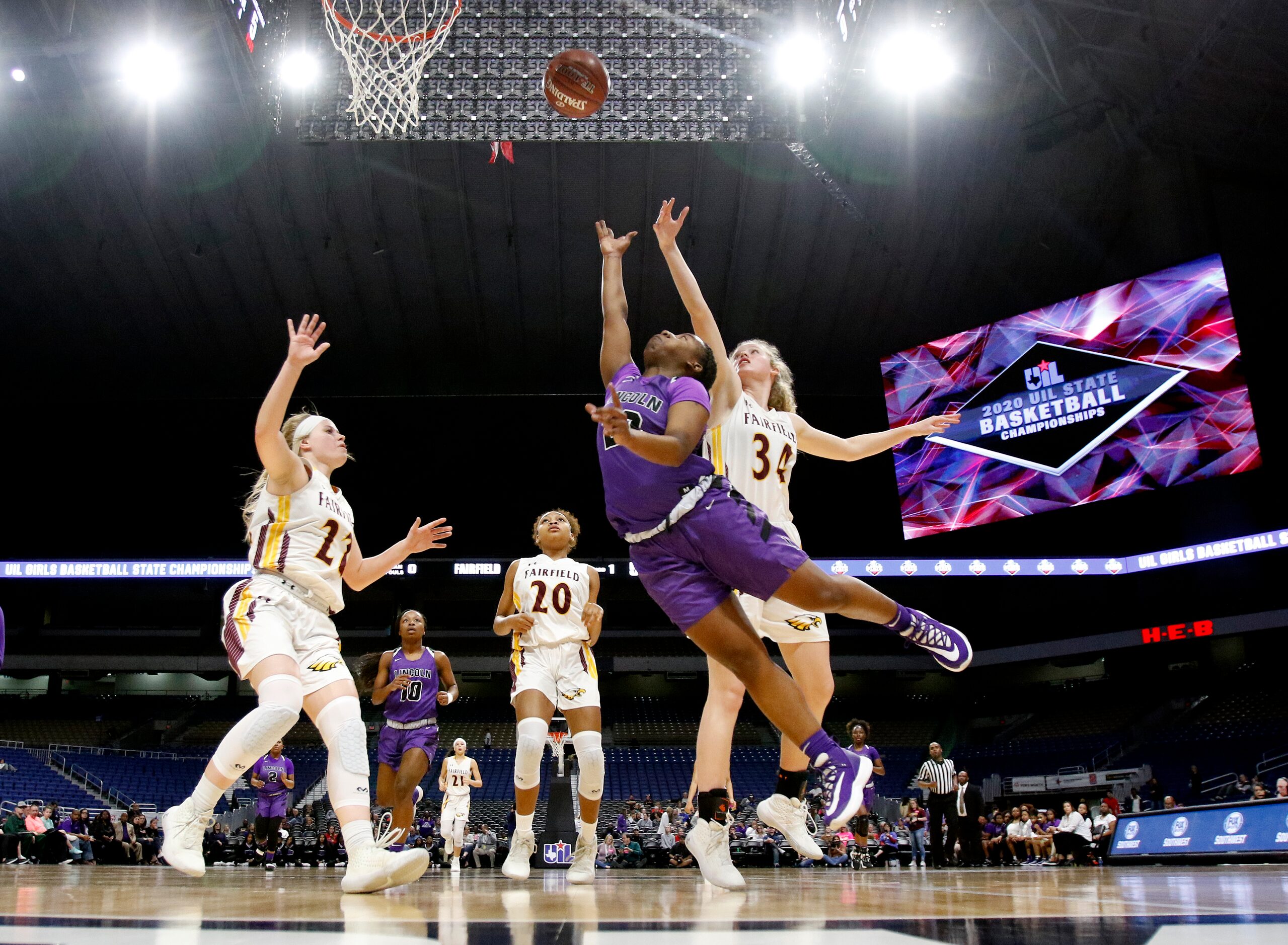 Lincoln guard Nakia Brumley (#20) drives for two in a 4A semifinal against Fairfield on...