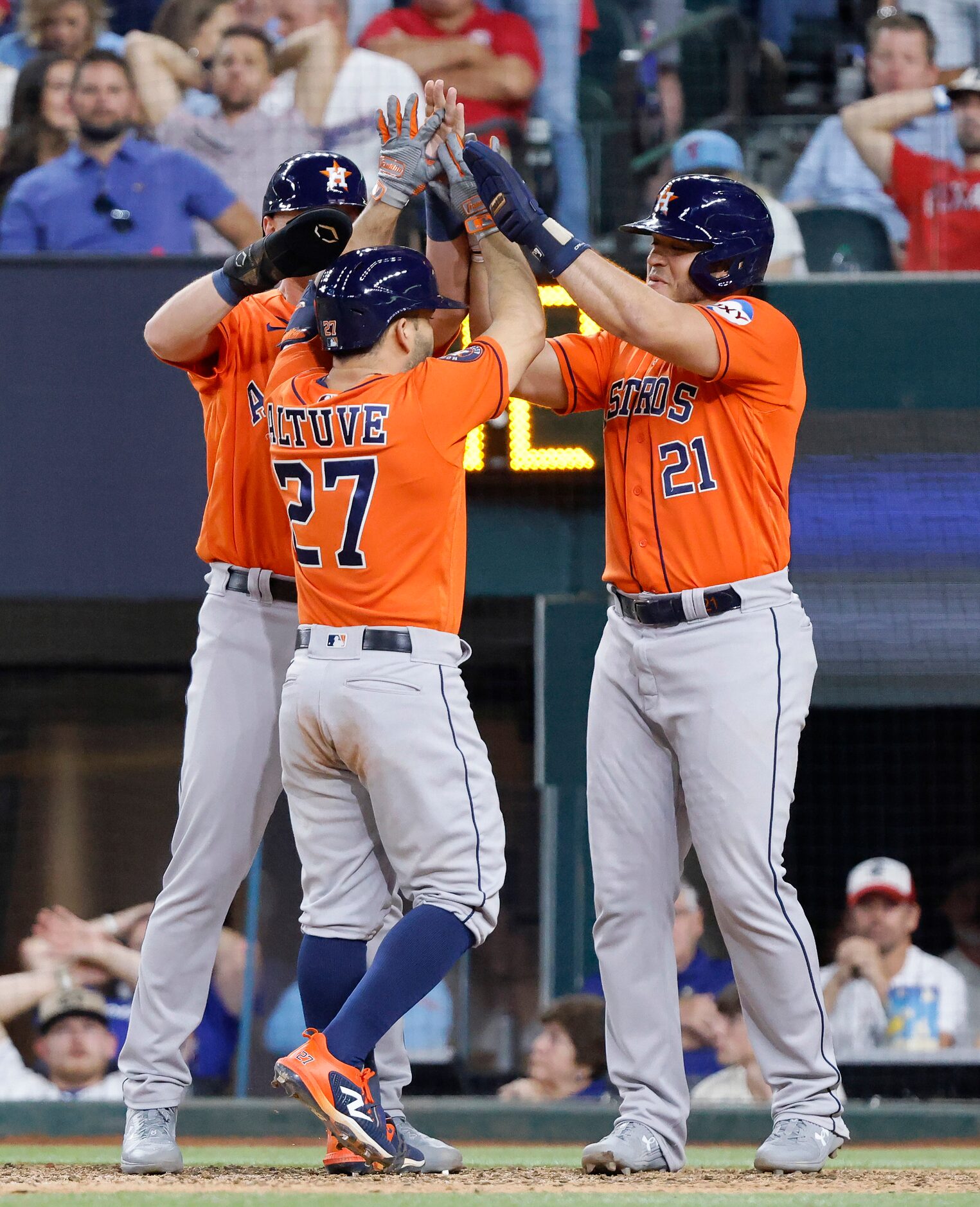 Houston Astros Grae Kessinger (16) and Yainer Diaz (21) congratulate Jose Altuve (27) for...