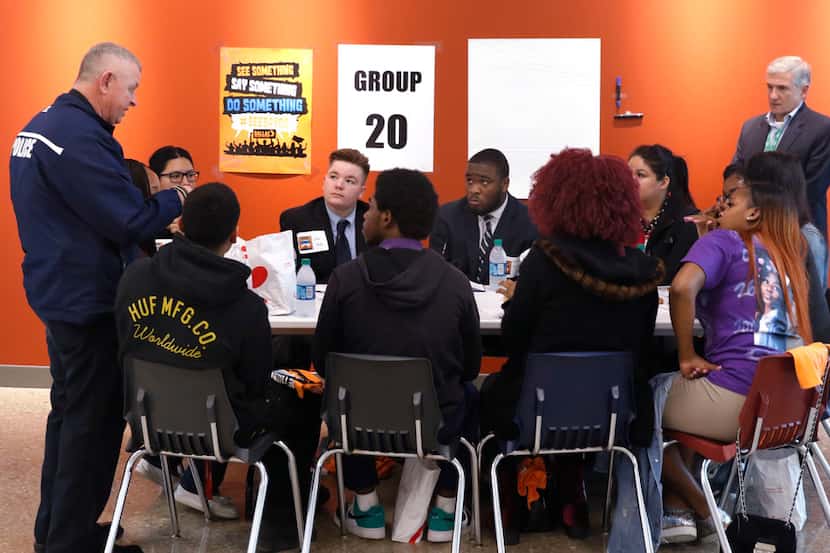Dallas ISD police Chief Craig Miller (left) and trustee Dan Micciche listened to students at...
