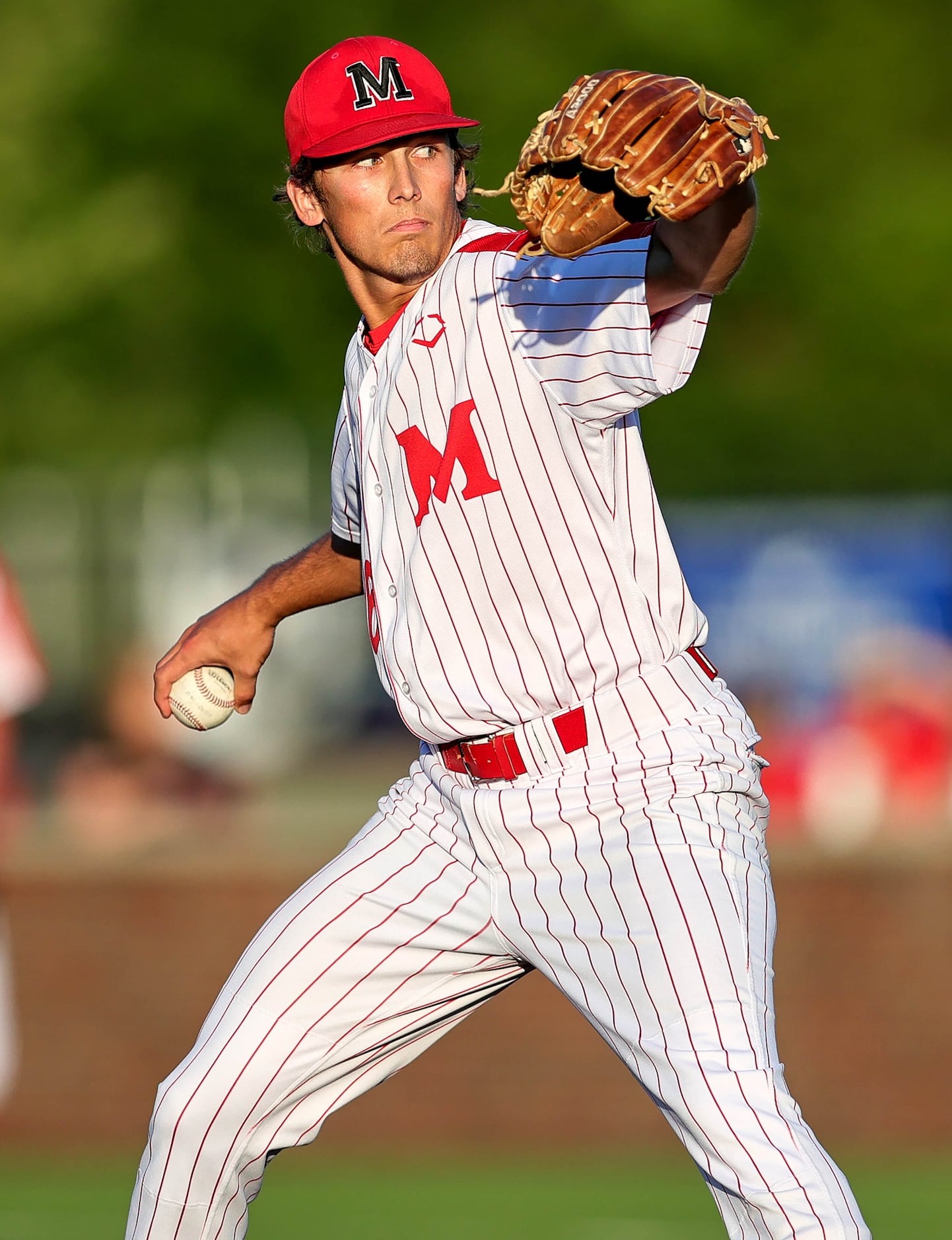 Flower Mound Marcus starting pitcher Tate Evans faces Keller during game 1 of the 6A Region...