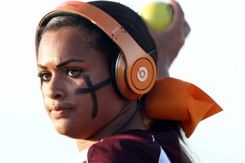 Mansfield Timberview's sophomore pitcher Mariah Denson (22) uses music during warm ups to...
