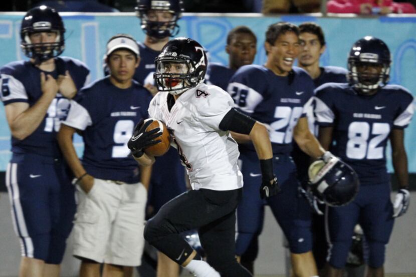 Euless Trinity wide receiver Edrick Gonzales races down the sideline for a big catch and run...