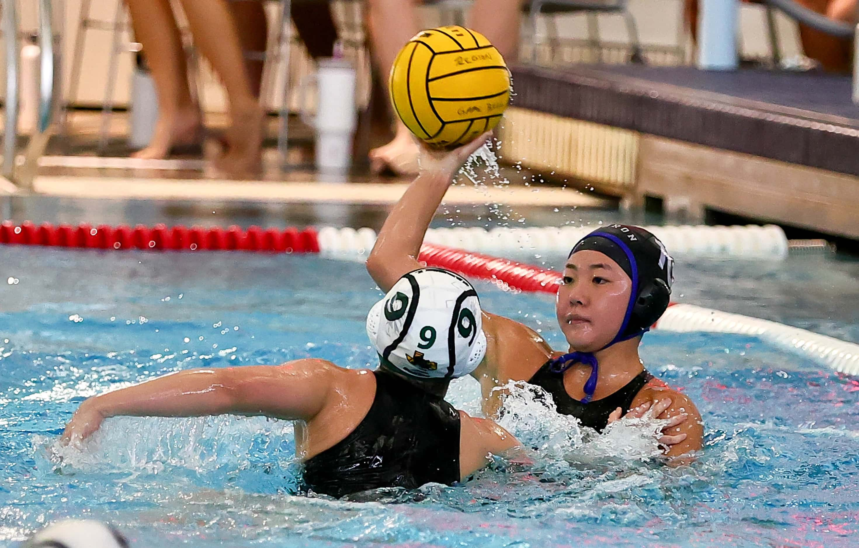 Hebron's Mollie Cho (10) looks to make a pass against Southlake Carroll's Kaitlyn Jiuliano...