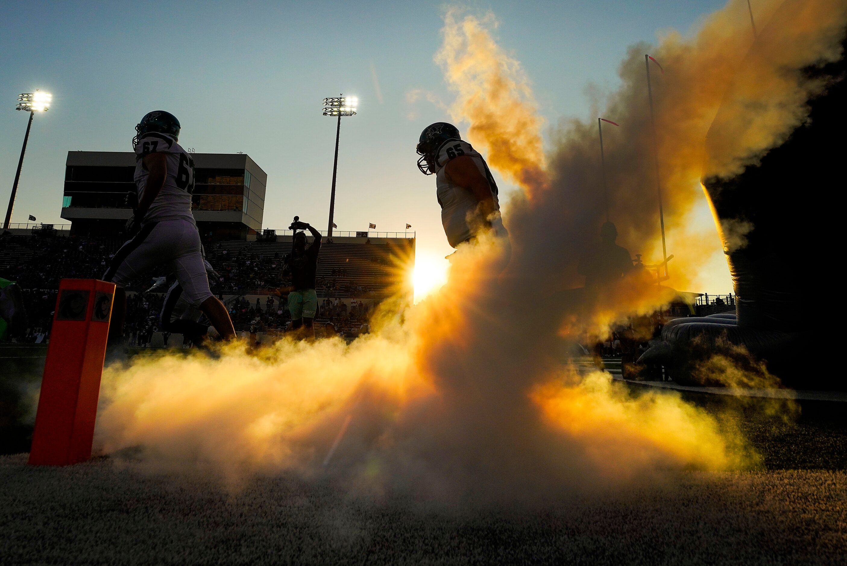 Prosper offensive linemen Bryce Tennison (67) and Kaden Jesmer (65) take the field to face...