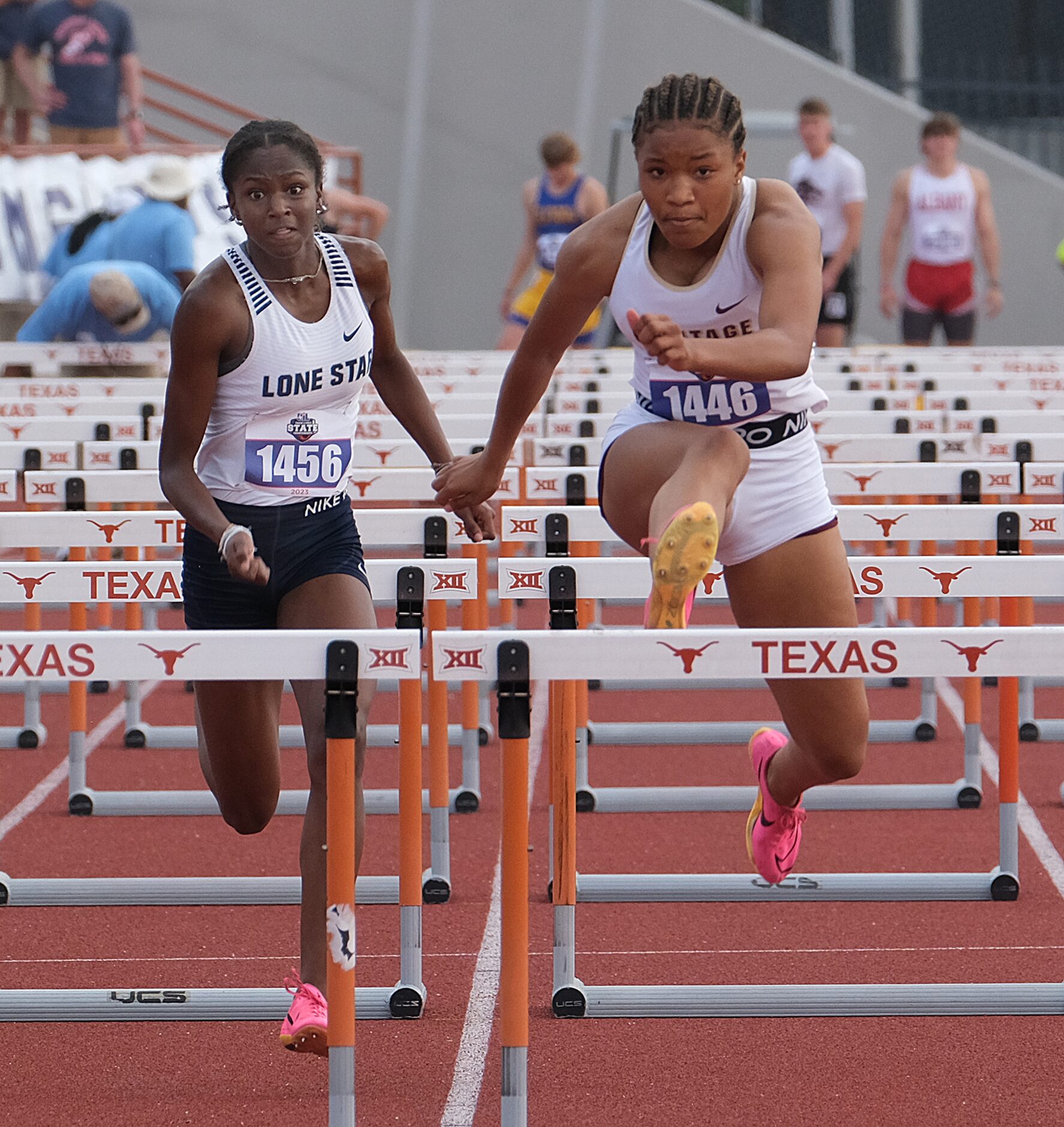 Kelis Jules for Frisco Lone Star on left and Kaylah Braxton of Frisco Heritage compete in...