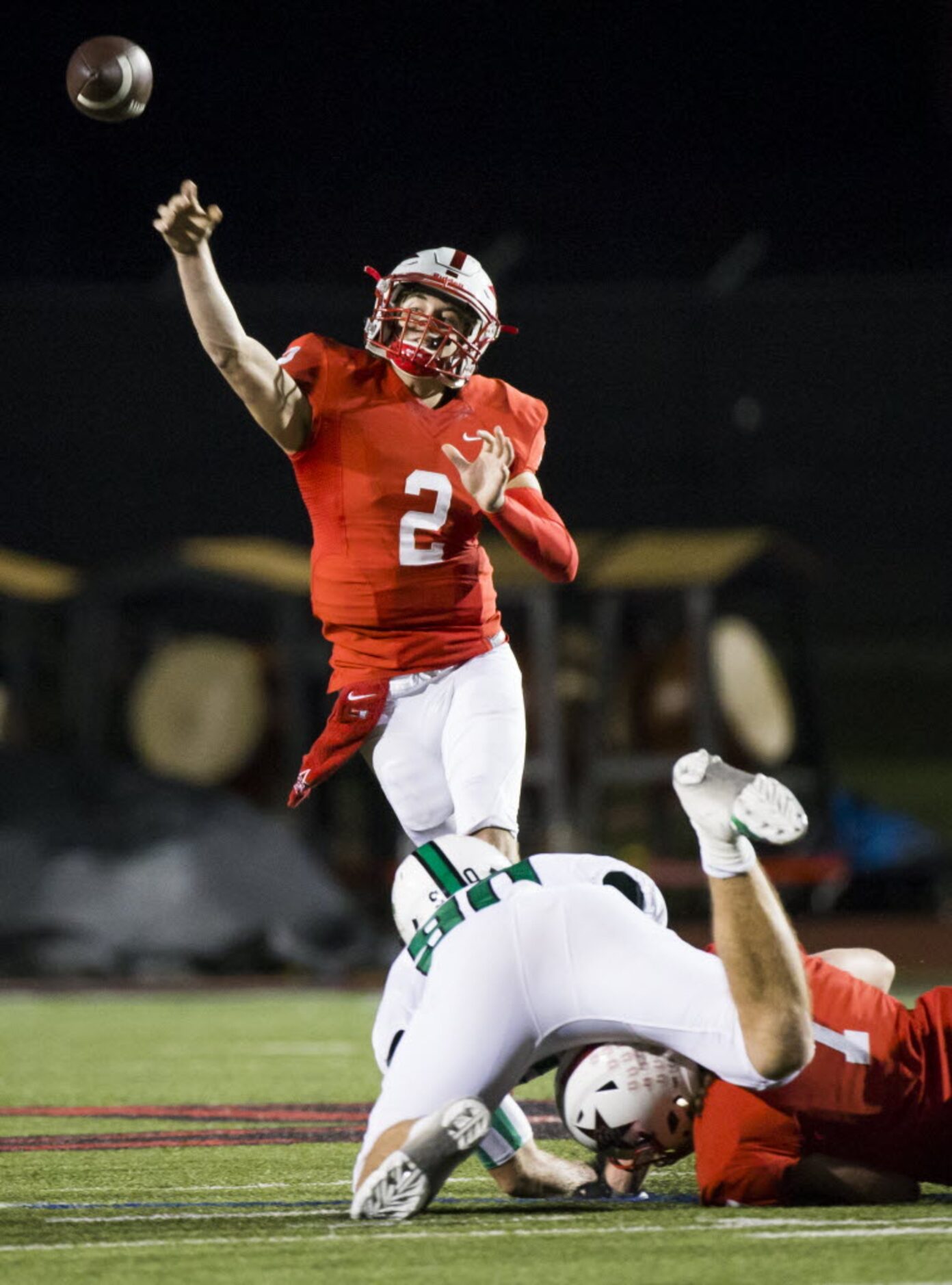 Coppell quarterback  Brady Mcbride (2) throws a pass over Southlake Carroll defensive...