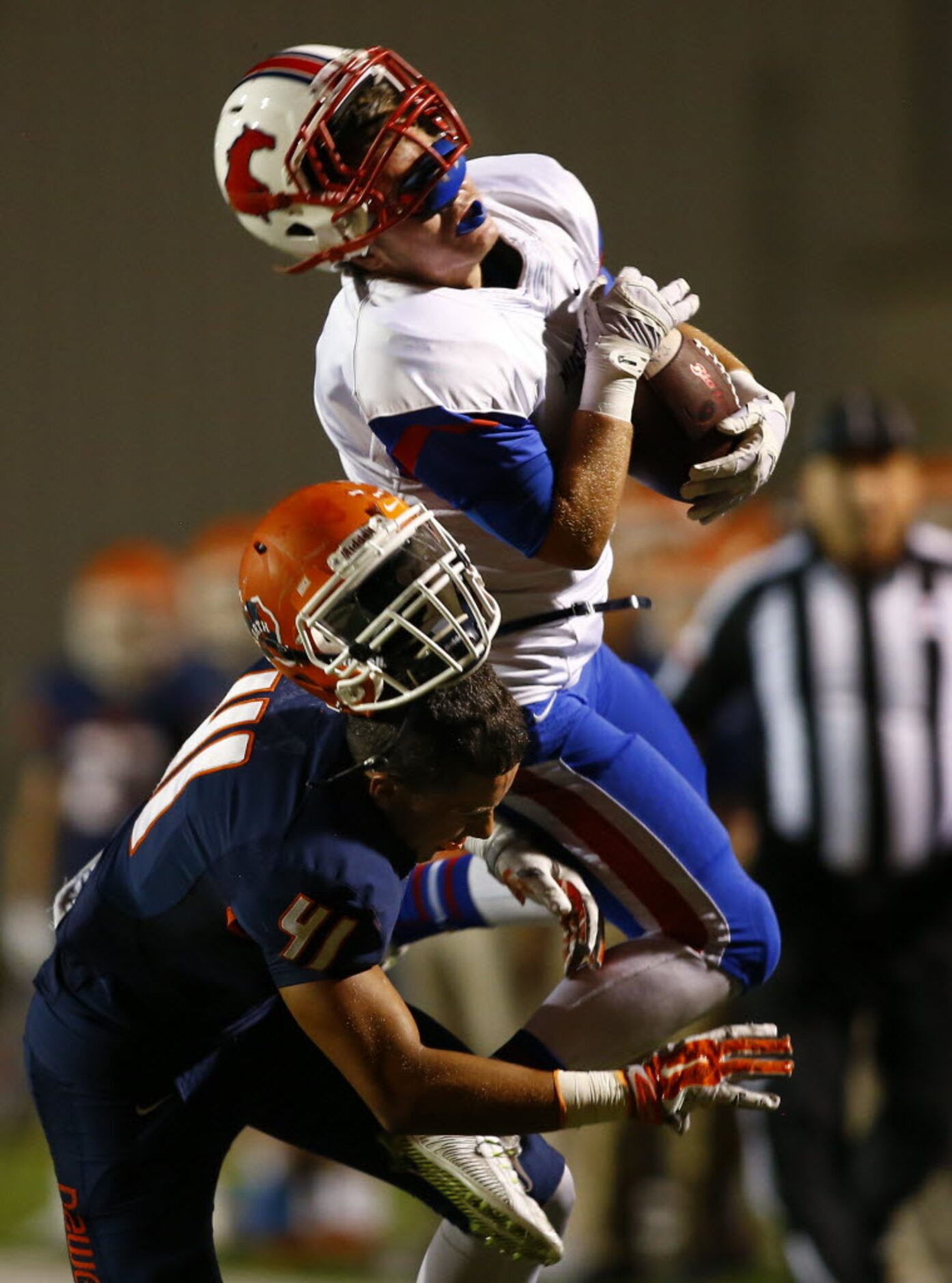 TXHSFB Richardson Pearce wide receiver Spencer Mandell (4) is hit hard by McKinney North...