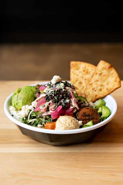 One of Cava's chef-curated bowls is the Lentil Avocado Bowl, which is built with falafel,...