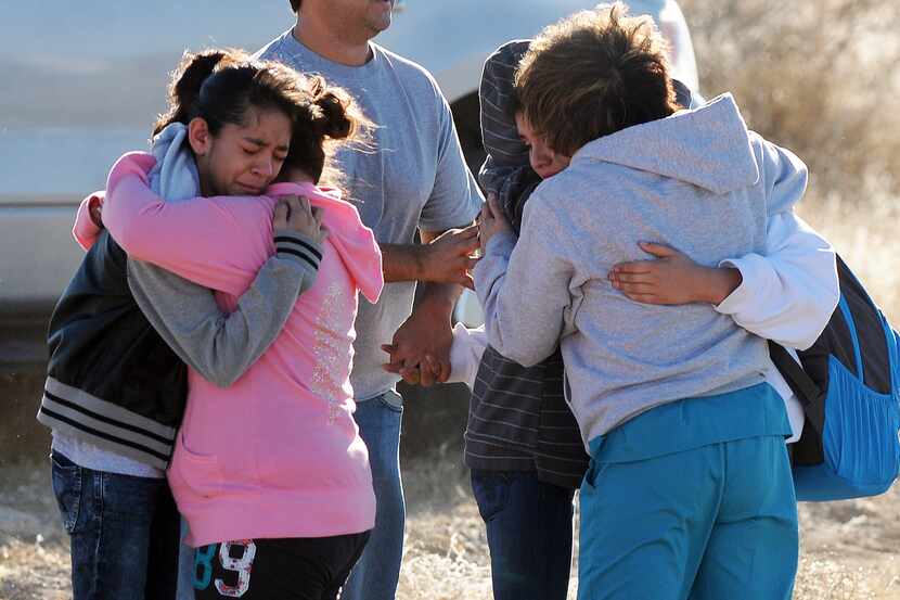 Students are reunited with family following a shooting at Berrendo Middle School, Tuesday,...