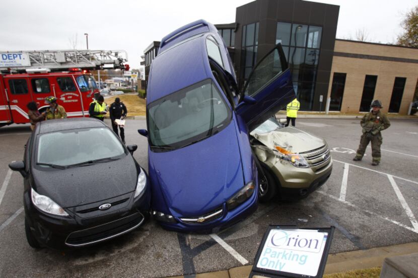 A 26-year-old driver backing out of a parking space at a restaurant ended up landing on a...