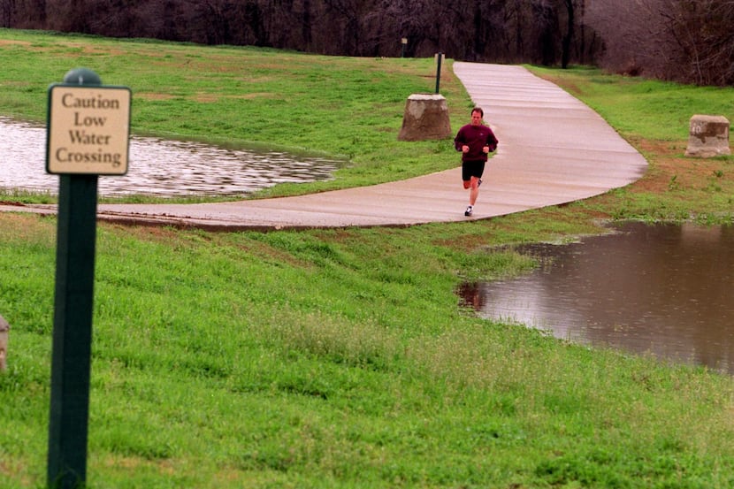 A jogger runs along Campion Trail in north Irving. The city ranks 82nd out of 100 of the...