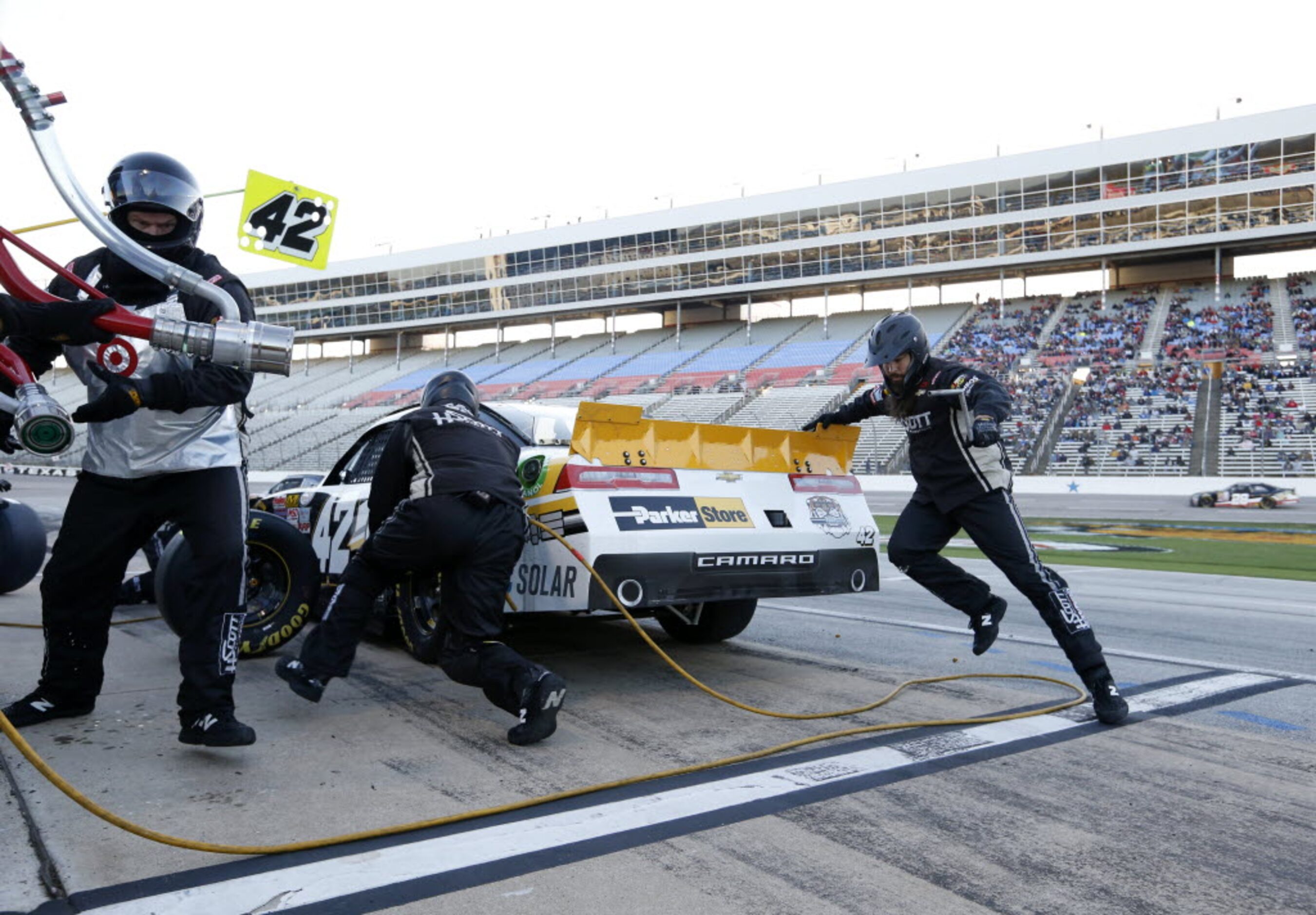 Pit crew works on Kyle Larson (42) car during a pit stop during the NASCAR XFINITY SERIES...