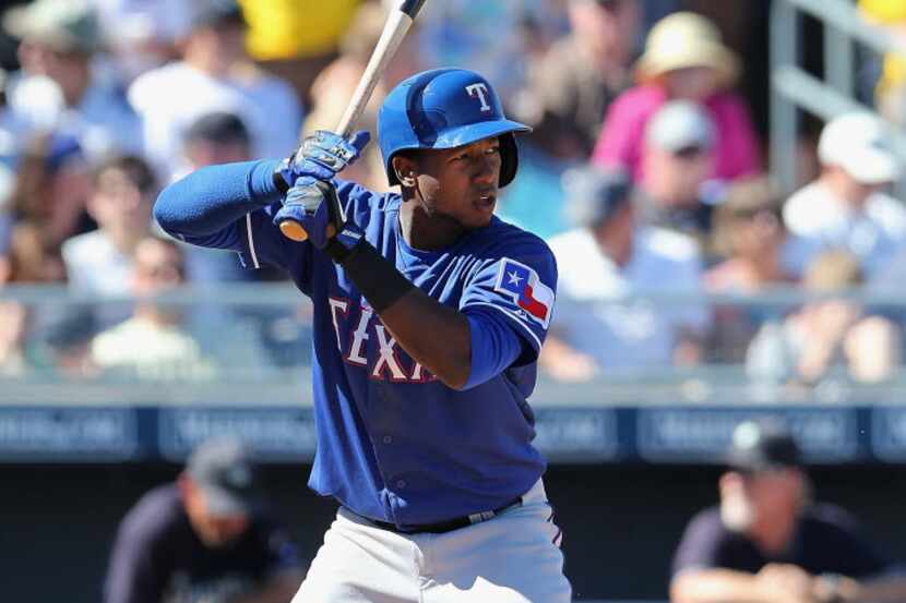 PEORIA, AZ - MARCH 09:  Jurickson Profar #13 of the Texas Rangers bats against the Seattle...