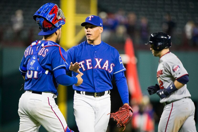 Texas Rangers relief pitcher Keone Kela celebrates with Texas Rangers catcher Robinson...