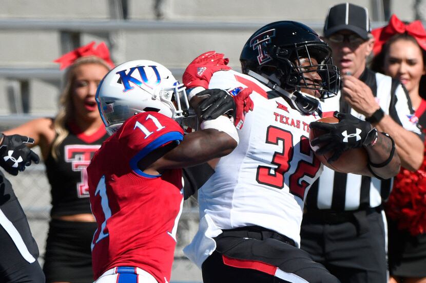 LAWRENCE, KS - OCTOBER 7: Desmond Nisby #32 of the Texas Tech Red Raiders scores against...