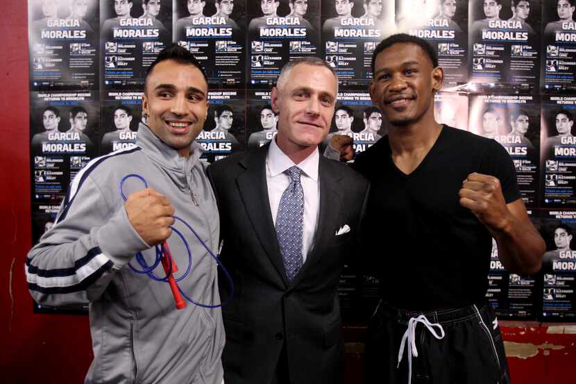Boxers Paul Malignaggi, left, and Daniel Jacobs, right, pose for pictures with Barclays...