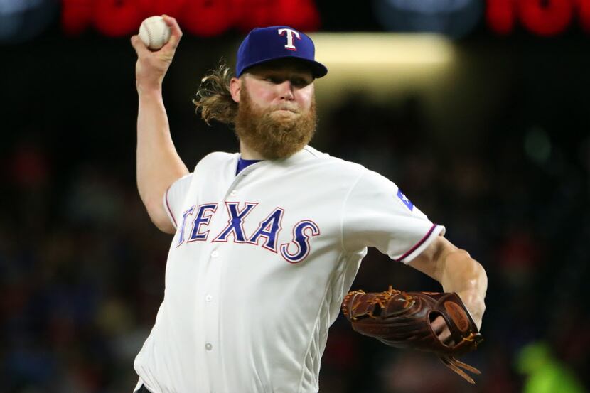 ARLINGTON, TX - JULY 05:  Andrew Cashner #54 of the Texas Rangers pitches against the Boston...