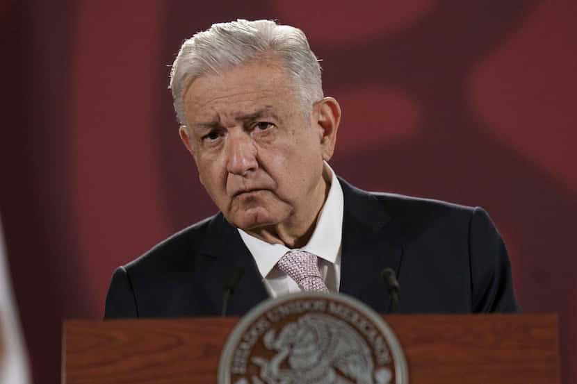 FILE - Mexican President Andres Manuel Lopez Obrador listens to a journalist's question...