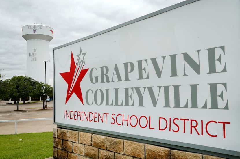 The Grapevine-Colleyville ISD sign is pictured before a Grapevine, Texas water tower,...