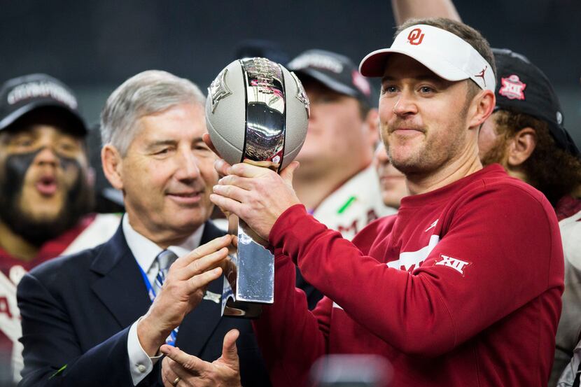 FILE - Oklahoma Sooners head coach Lincoln Riley receives the Big 12 Championship trophy...