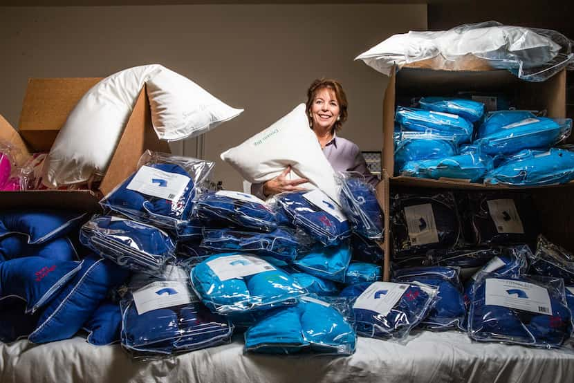 Merrimac Dillon is photographed with her U-shaped travel pillows that Oprah Winfrey named as...