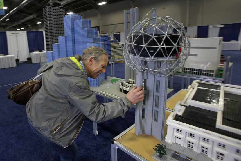 Trammell S. Crow examined a replica of downtown Dallas made out of Legos as he checked out...