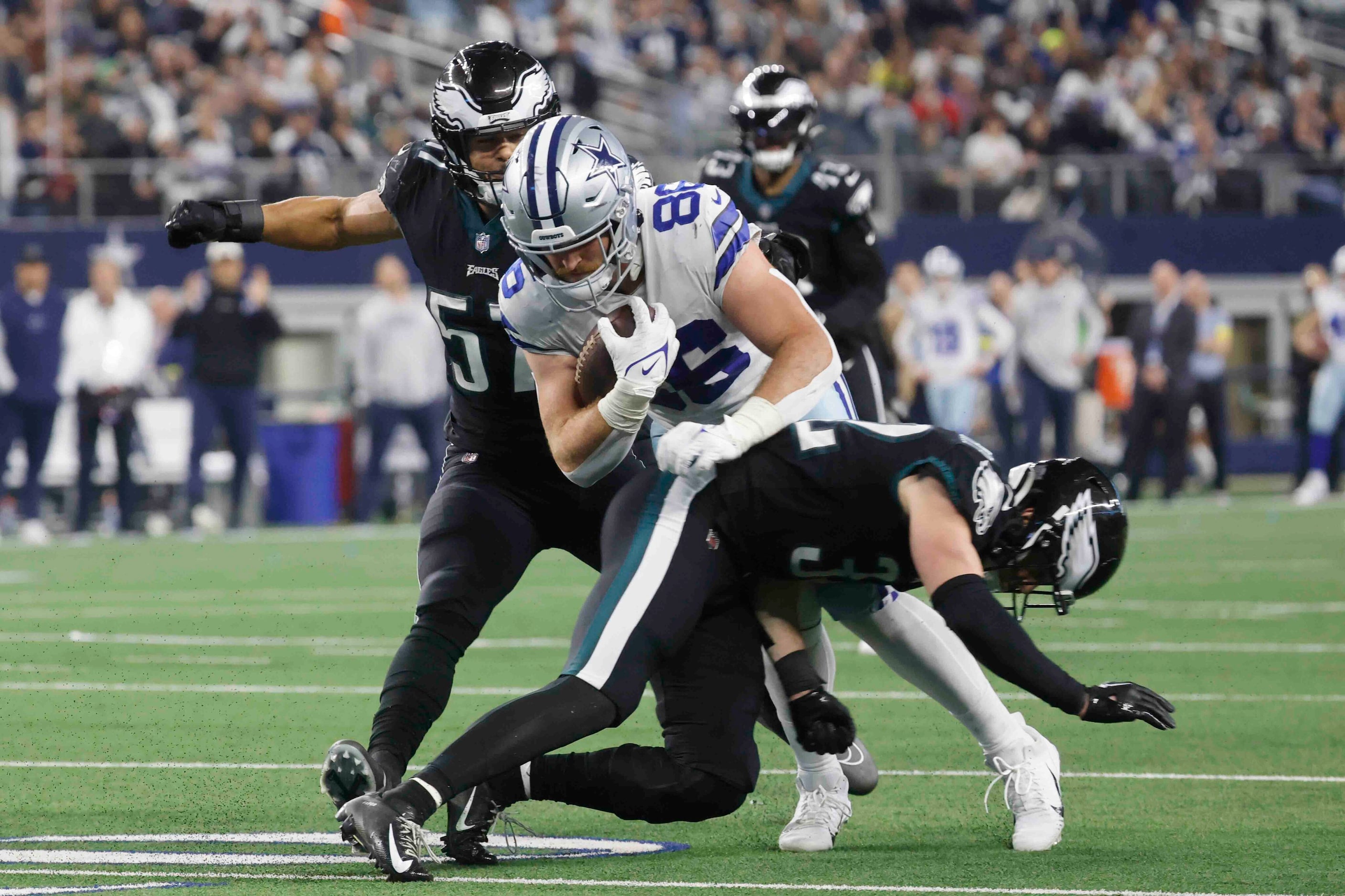 Dallas Cowboys tight end Dalton Schultz (86) gets pressed against Philadelphia Eagles safety...