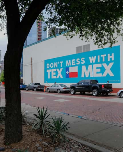 On the flagship El Fenix in downtown Dallas, a mural says "Don't mess with Tex-Mex."