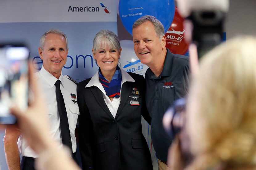 American Airlines CEO Doug Parker (right) joined pilot Greg Kunasek and flight attendant...