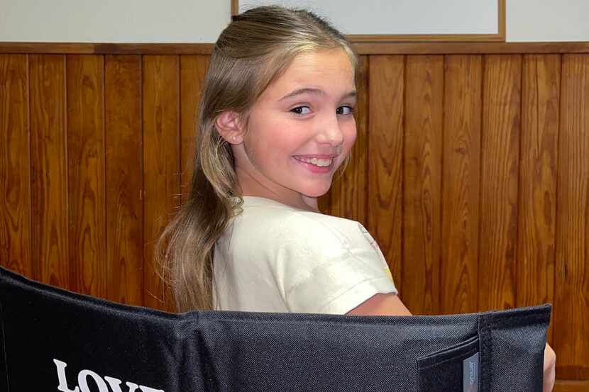 Harper Heath, a 10-year-old actor from Rockwall, finds her seat on the set of "Love & Death."