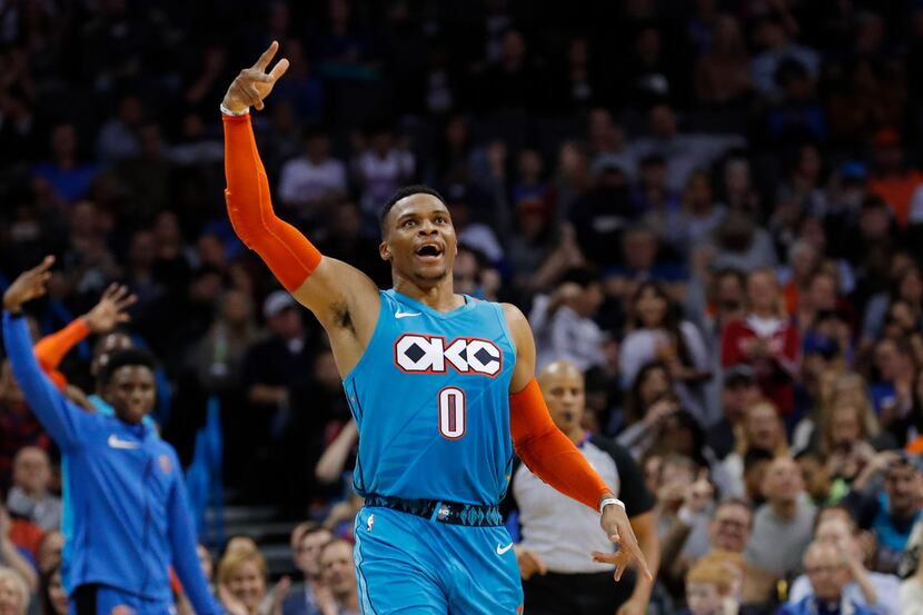 Oklahoma City Thunder guard Russell Westbrook reacts after shooting a 3-pointer against the...
