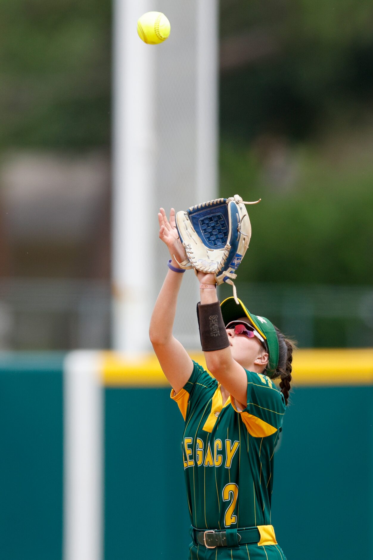 Frisco Legacy Christian infielder Lynlee Kennedy (2) catches the ball for an out during the...