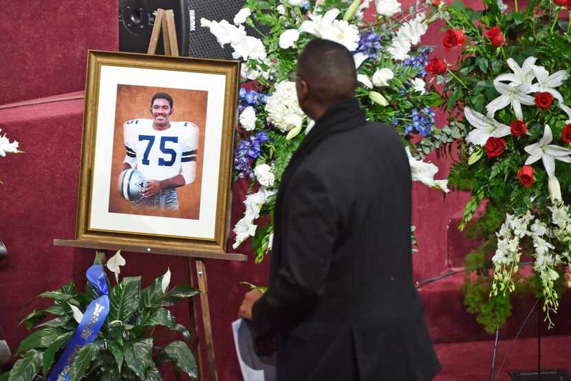People pay their respects prior to the funeral service for former Dallas Cowboys player...