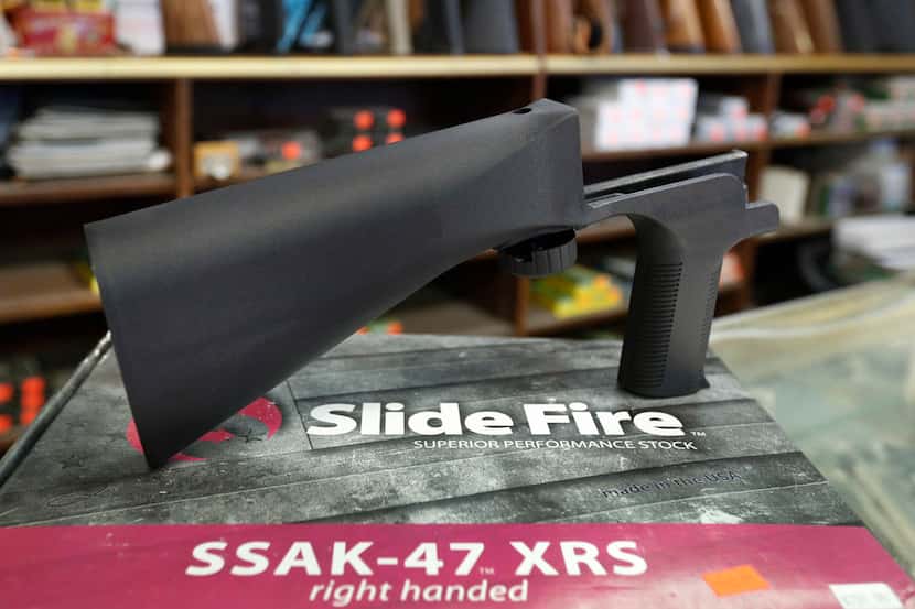 A bump stock device, made by Slide Fire, that fits on a semi-automatic rifle to increase the...