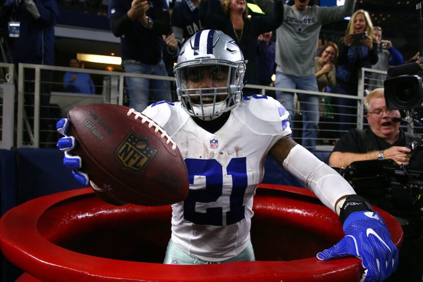ARLINGTON, TX - DECEMBER 18:  Ezekiel Elliott #21 of the Dallas Cowboys celebrates after...